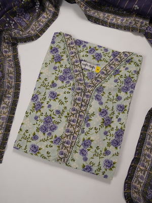 A folded light green kurta with a purple floral print and embroidered neckline, displayed on a white surface with a matching patterned scarf draped around it.